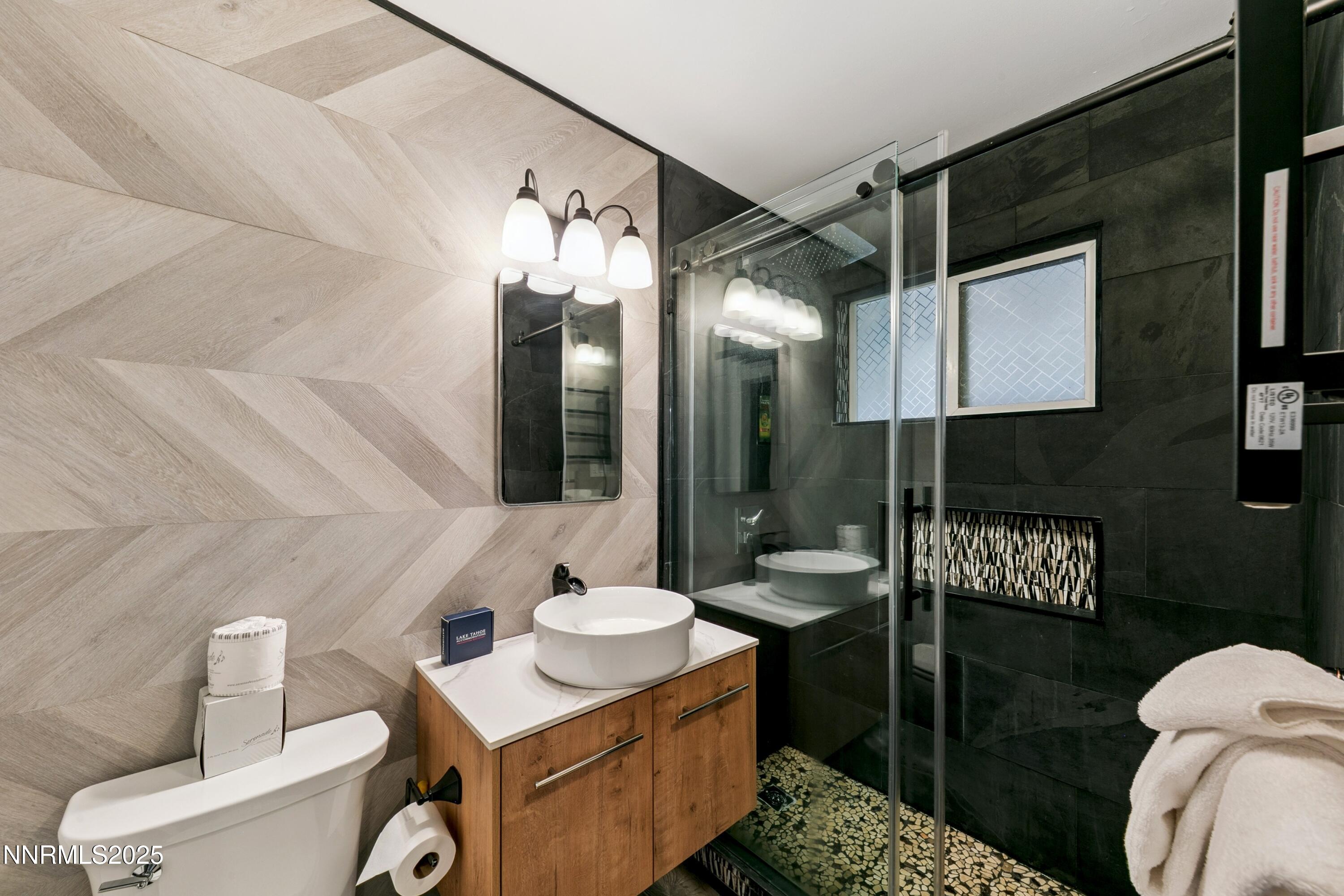 150 Woodland Way Stateline, NV 89449 - Photo 12 of 22 a bathroom with a sink toilet and shower