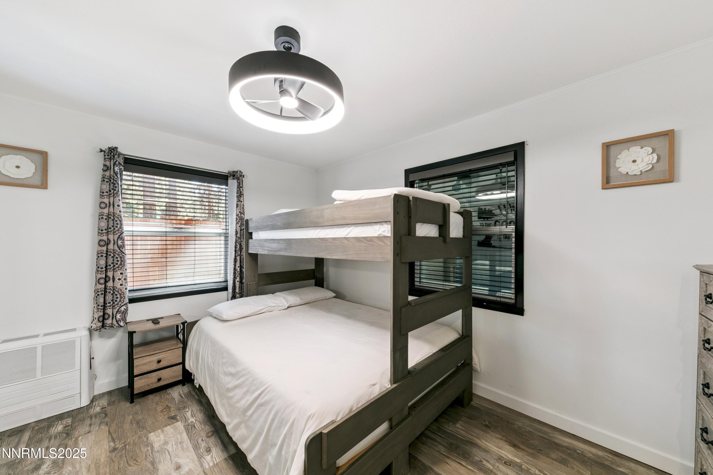 150 Woodland Way Stateline, NV 89449 - Photo 13 of 22 a bedroom with a bed and a mirror