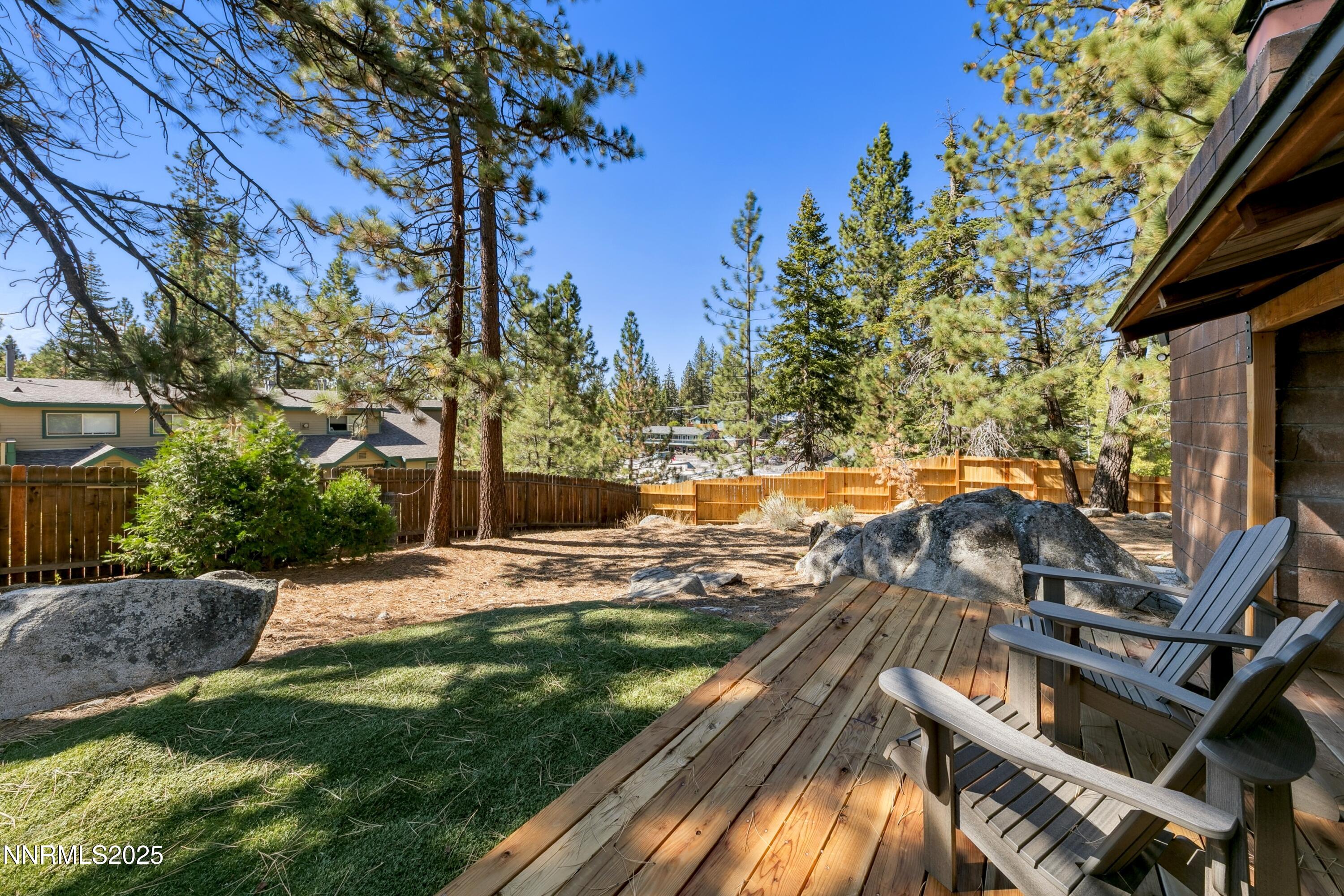 150 Woodland Way Stateline, NV 89449 - Photo 17 of 22 a view of a backyard with sitting area