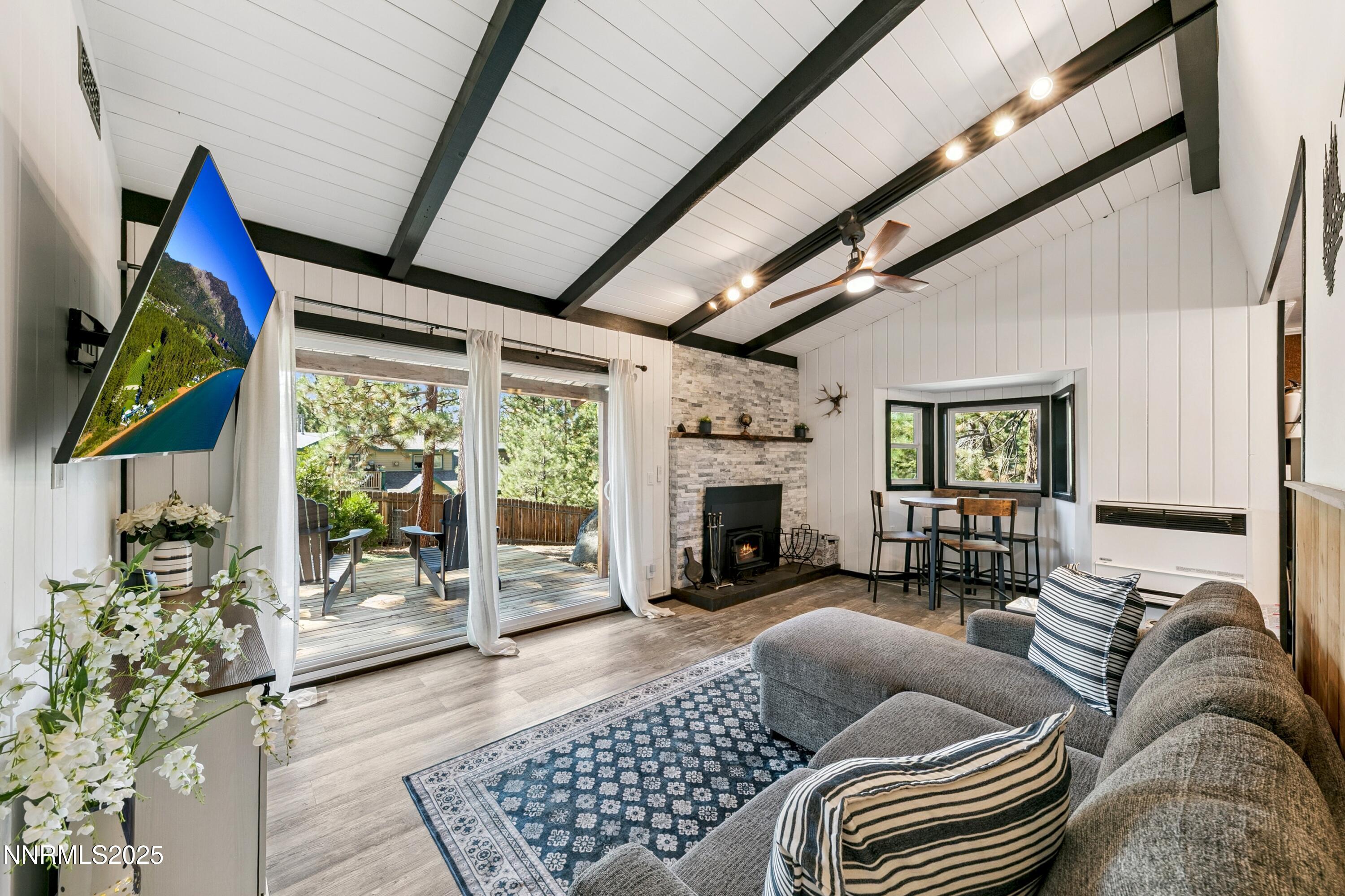 150 Woodland Way Stateline, NV 89449 - Photo 2 of 22 a living room with furniture and a fireplace