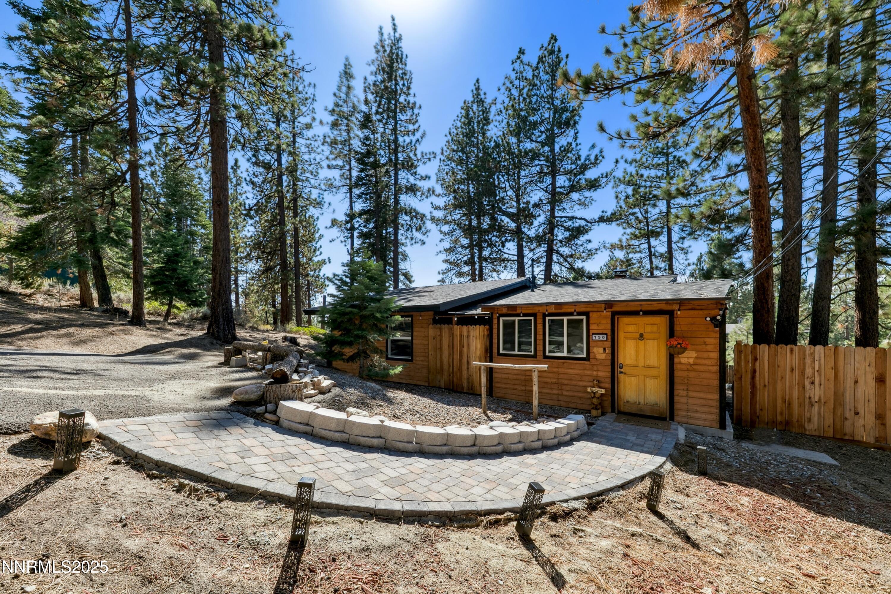150 Woodland Way Stateline, NV 89449 - Photo 22 of 22 a view of a house with backyard and sitting area