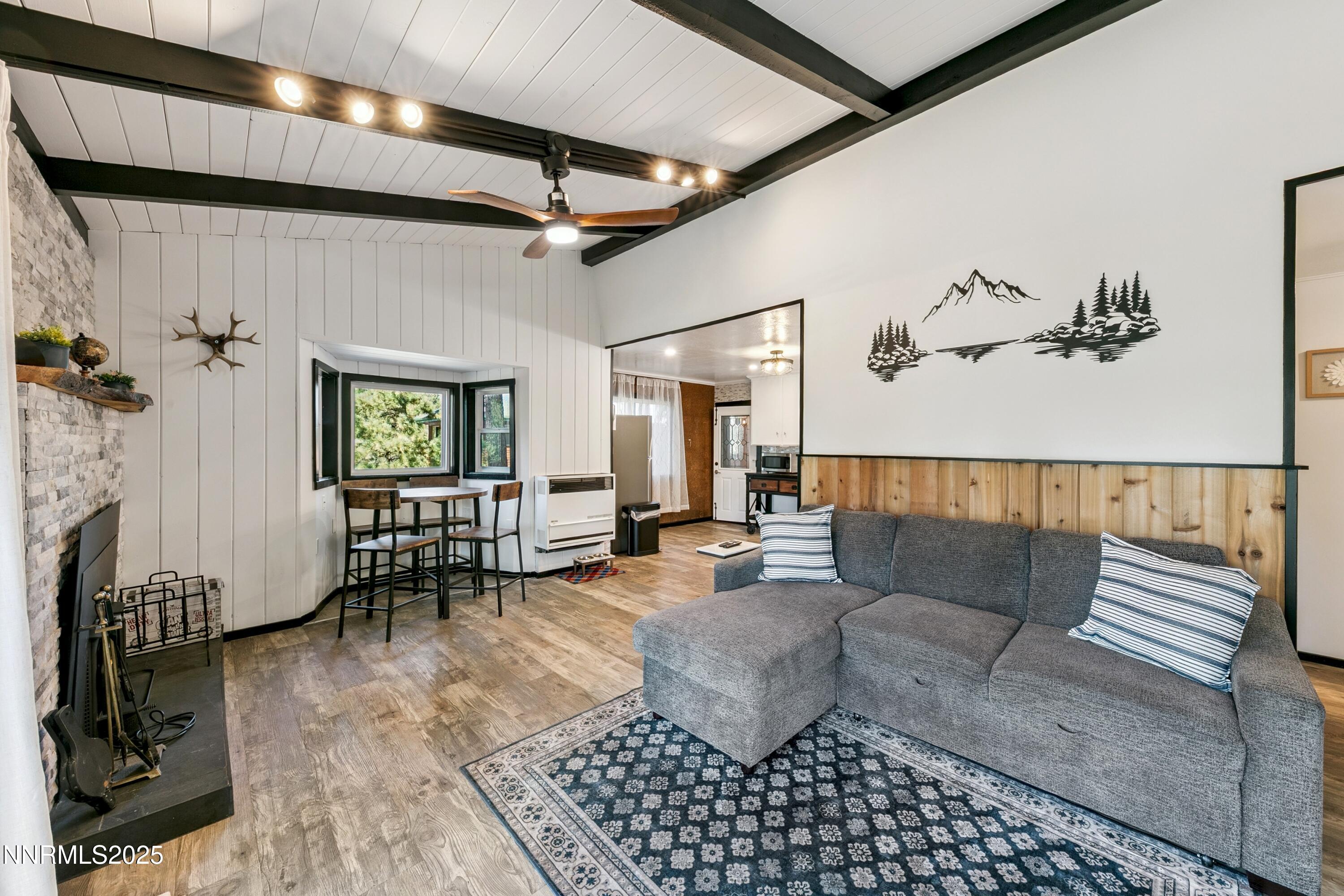 150 Woodland Way Stateline, NV 89449 - Photo 5 of 22 a living room with furniture and a fireplace