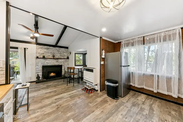a view of a livingroom with furniture and a fireplace