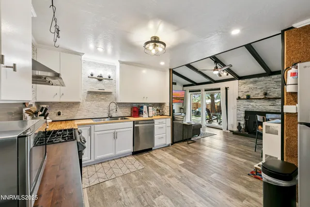 a kitchen with stove and cabinets