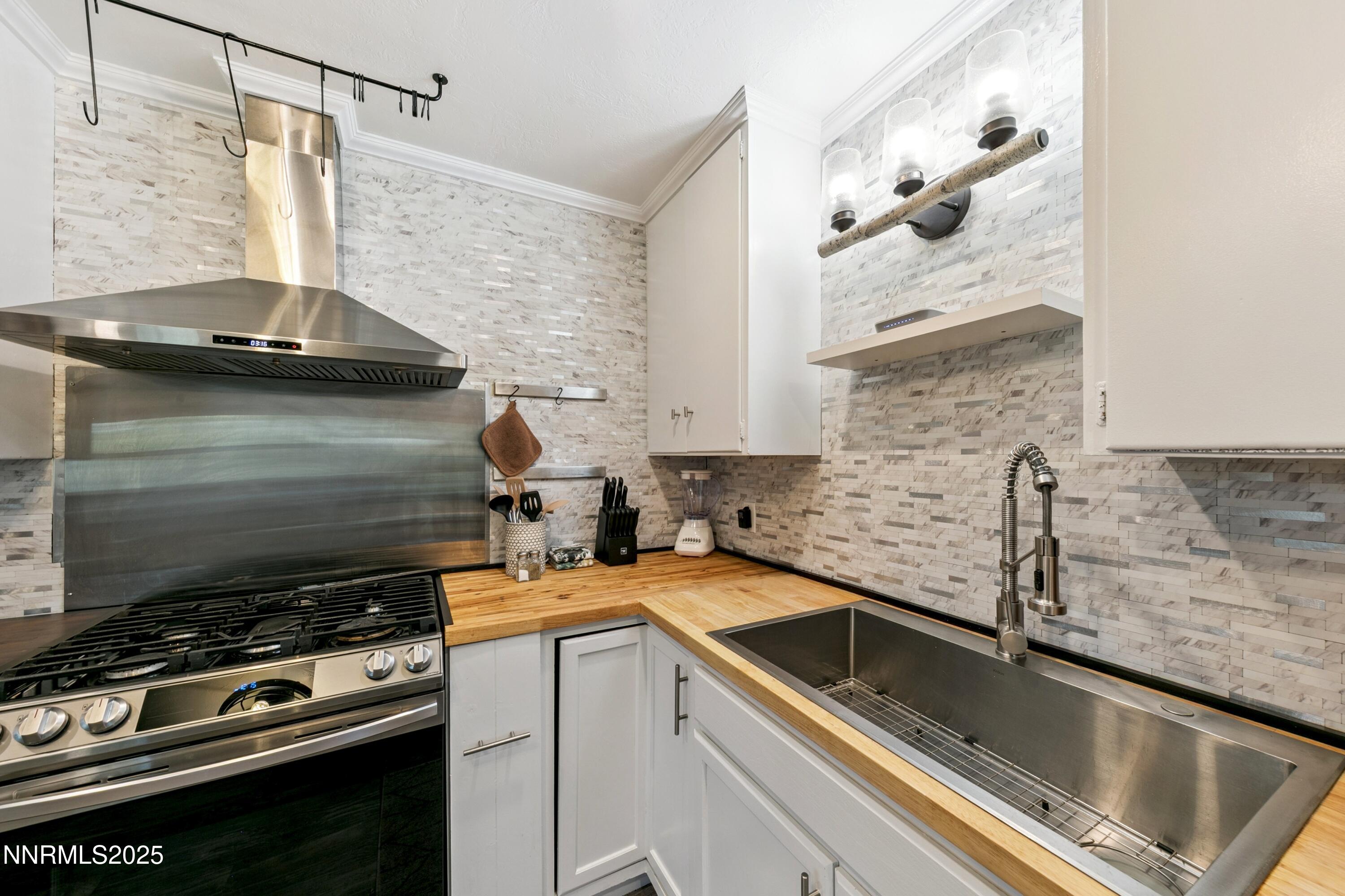 150 Woodland Way Stateline, NV 89449 - Photo 10 of 22 a kitchen with a sink and a stove