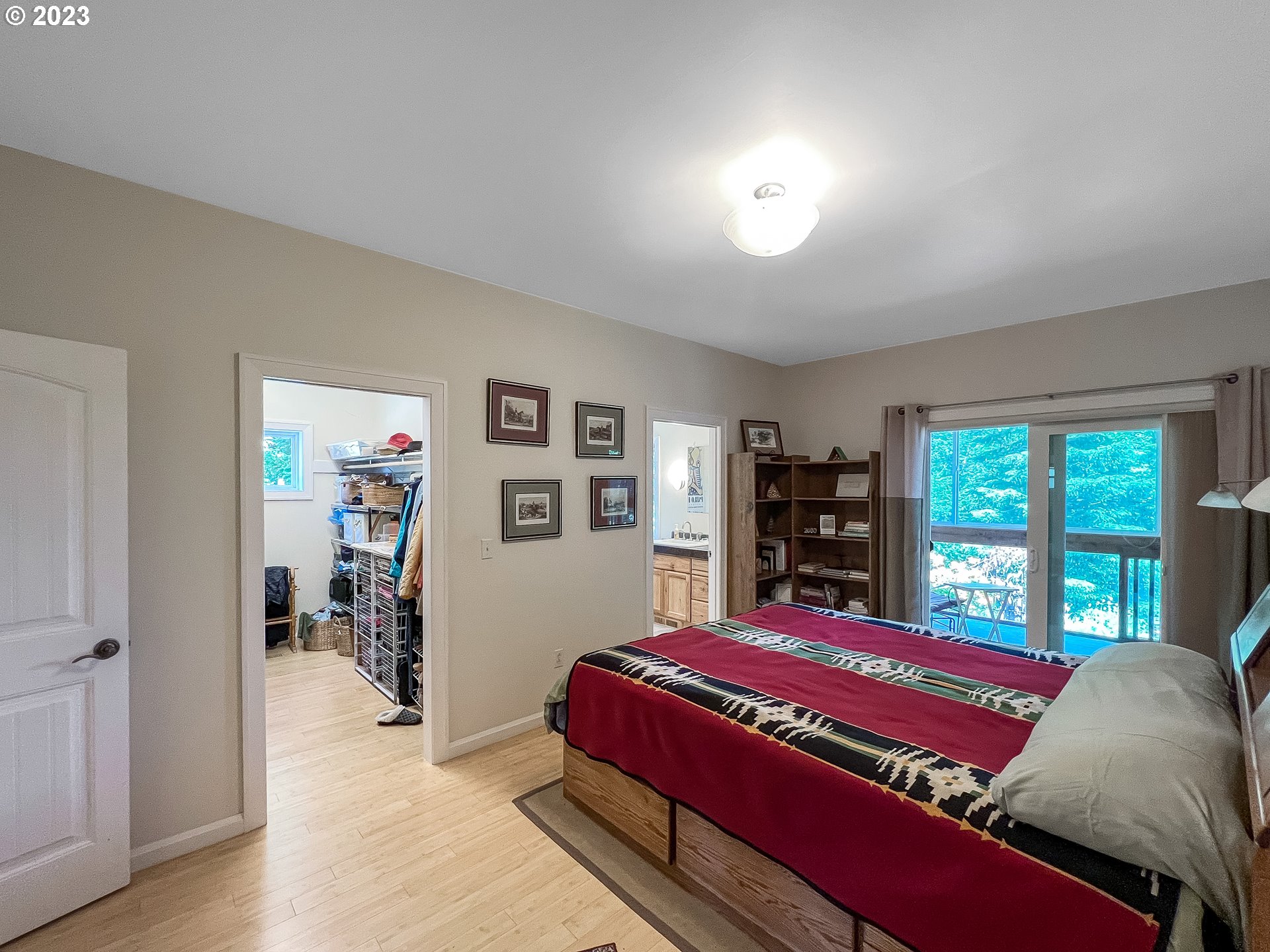 97313 Stagecoach Road Brookings, OR 97415 - Photo 23 of 44 a bed sitting in a bedroom next to a window