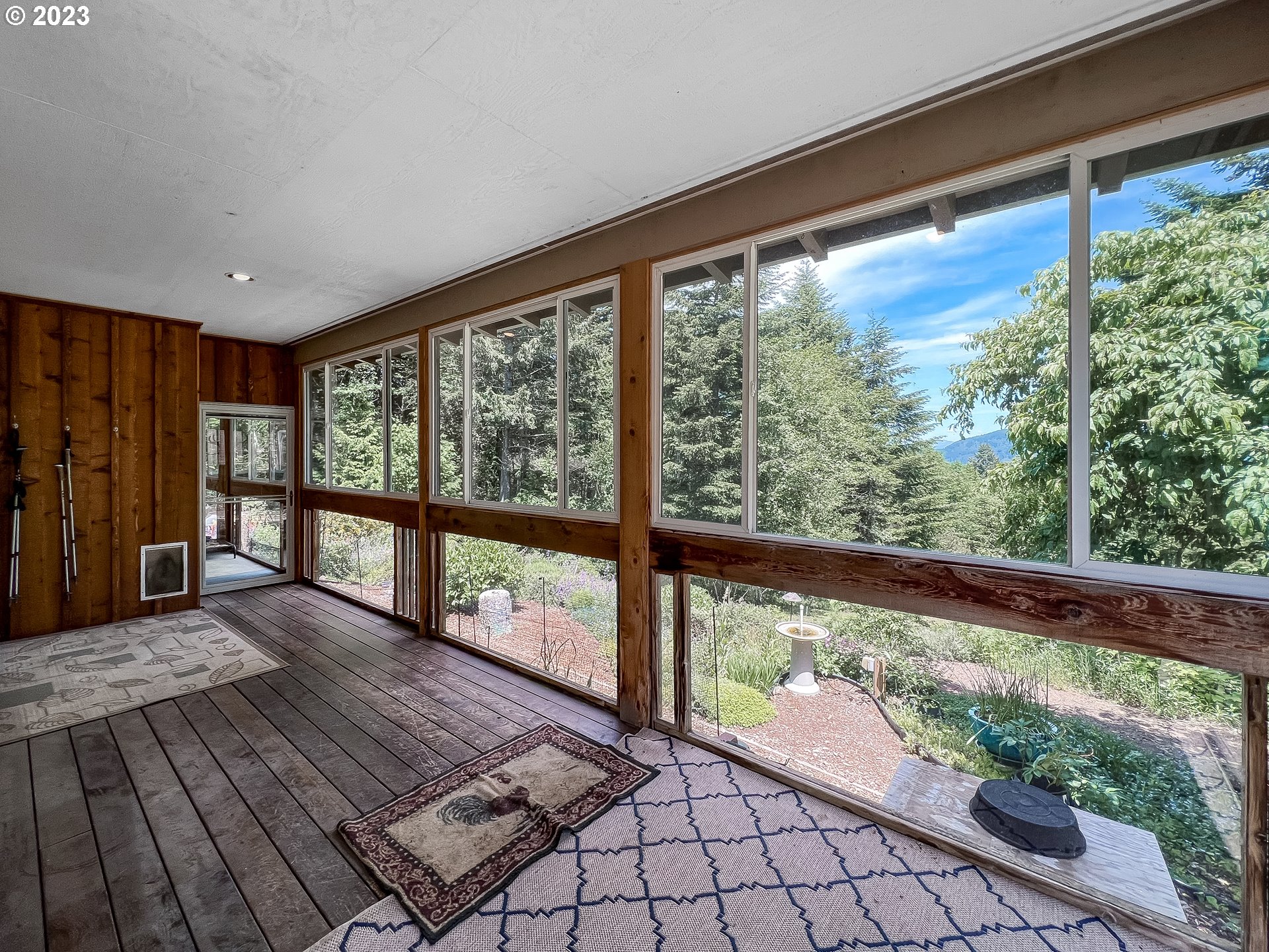 97313 Stagecoach Road Brookings, OR 97415 - Photo 32 of 44 a view of a porch with wooden floor and outdoor space