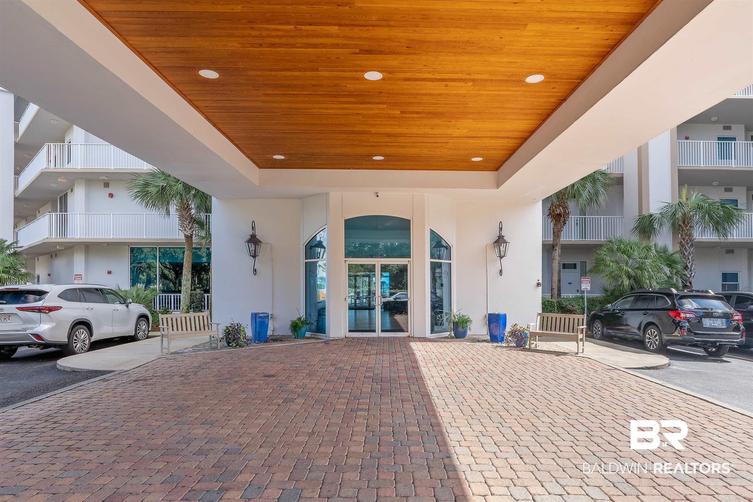 27800 Canal Road, Unit 113 Orange Beach, AL 36561 - Photo 4 of 35 View of exterior entry featuring stucco siding and french doors