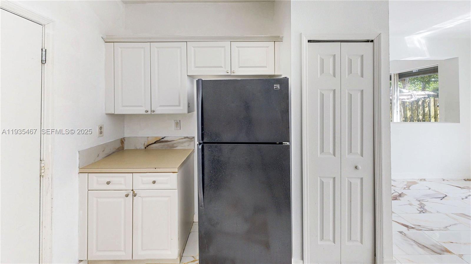 27345 Southwest 138th Court Homestead, FL 33032 - Photo 15 of 75 a kitchen with stainless steel appliances granite countertop a refrigerator and a cabinets