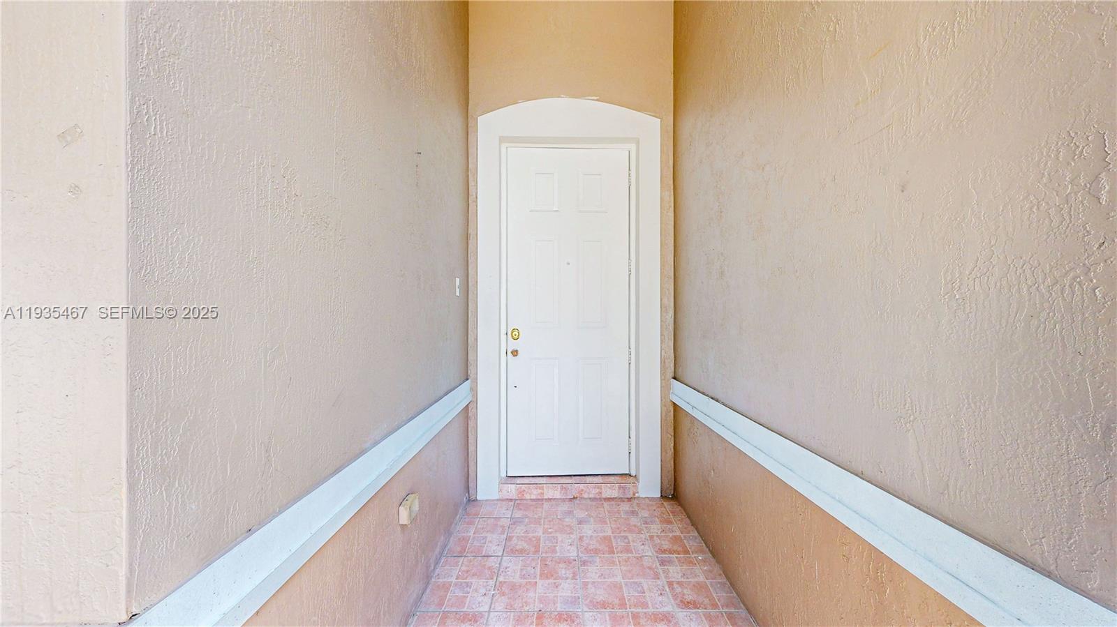 27345 Southwest 138th Court Homestead, FL 33032 - Photo 2 of 75 a view of hallway with wooden floor