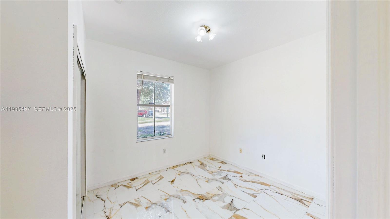 27345 Southwest 138th Court Homestead, FL 33032 - Photo 22 of 75 a view of a window in an empty room