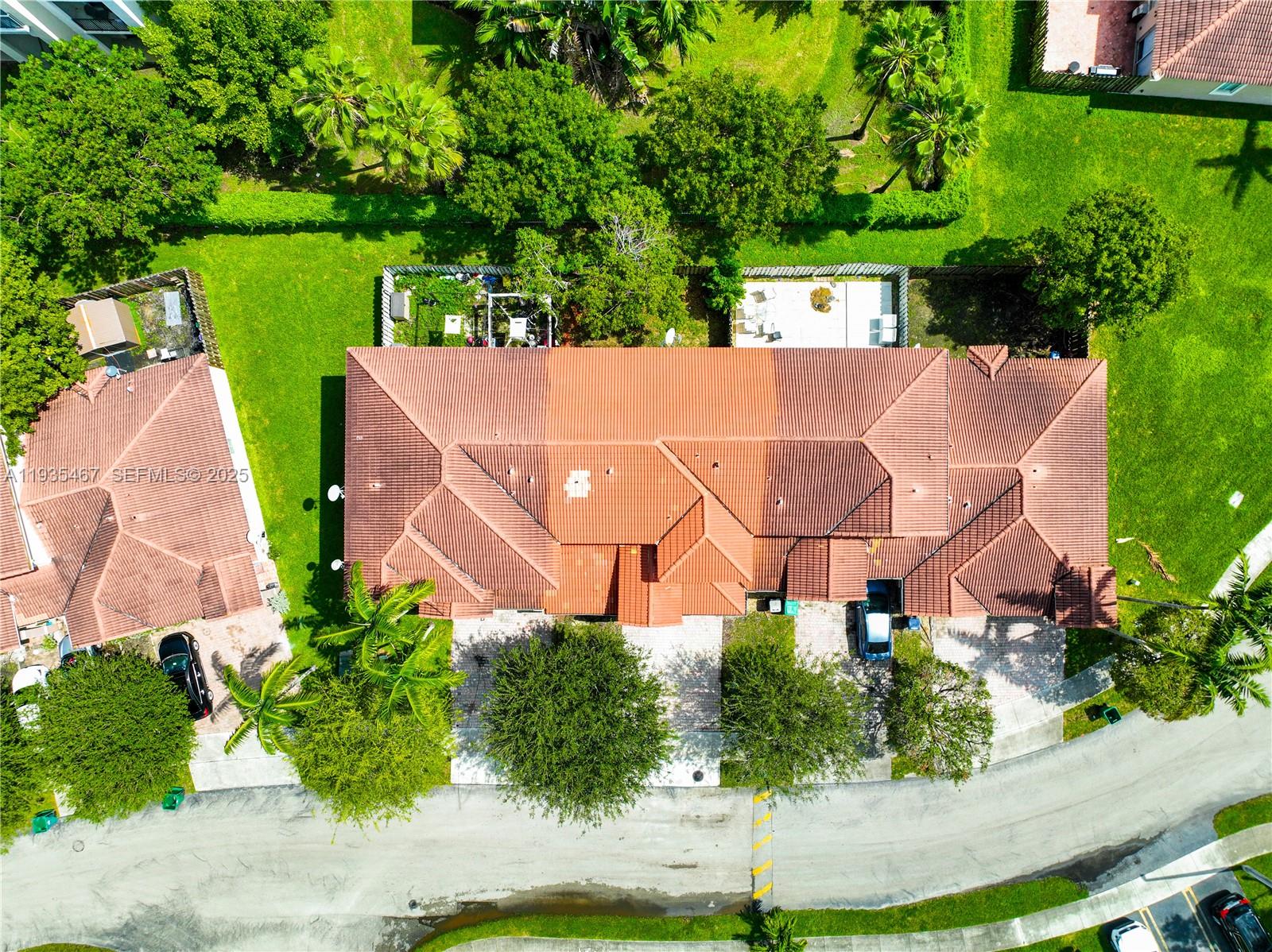 27345 Southwest 138th Court Homestead, FL 33032 - Photo 61 of 75 an aerial view of a house with garden space and street view