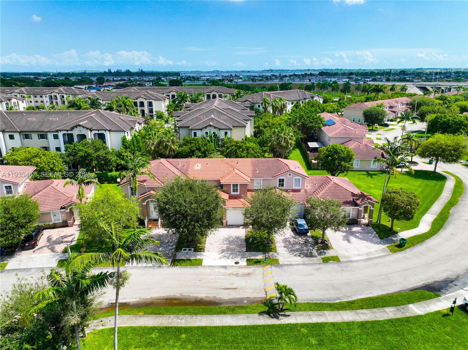 27345 Southwest 138th Court Homestead, FL 33032 - Photo 62 of 75 an aerial view of residential houses with outdoor space and river