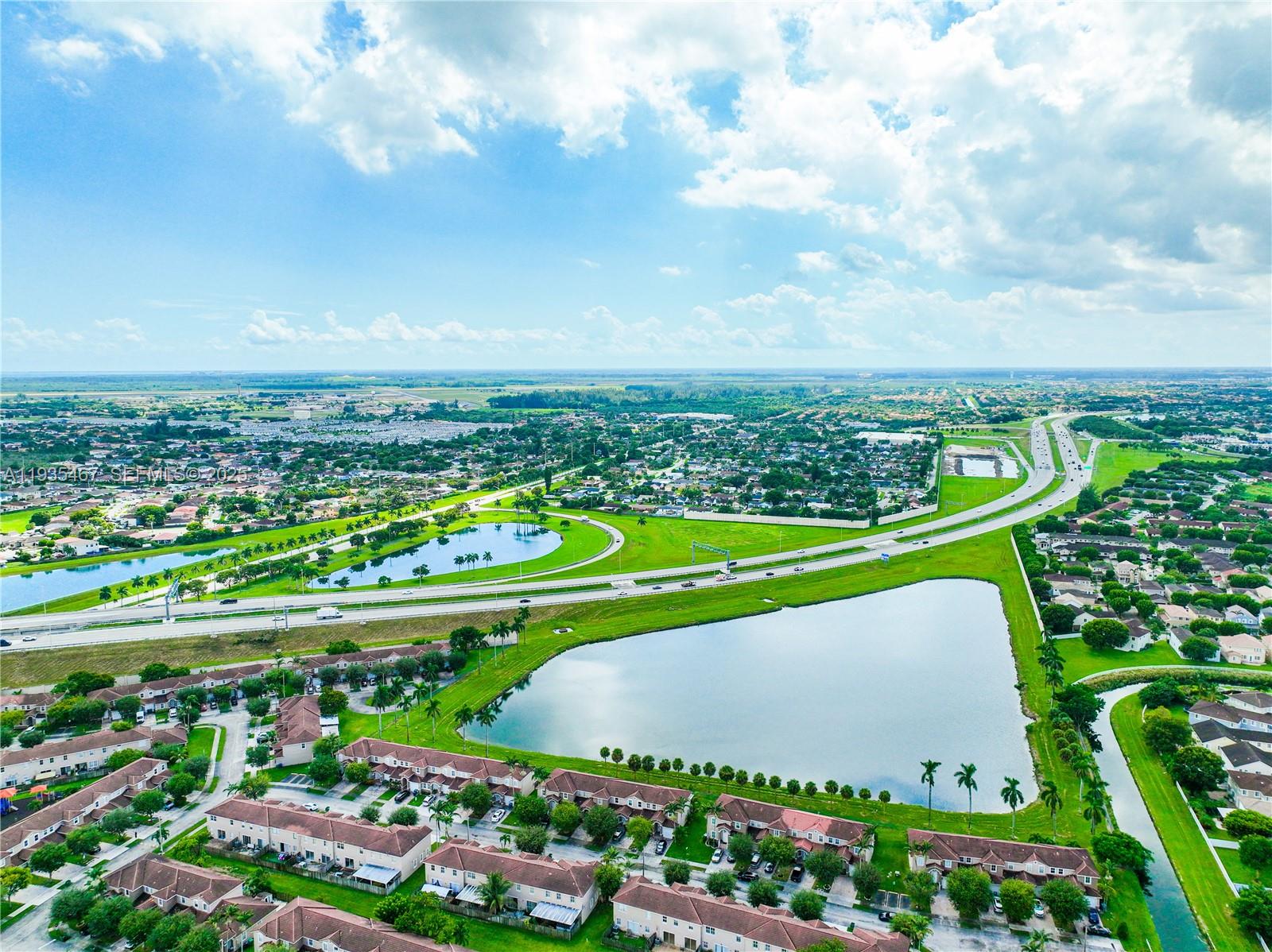 27345 Southwest 138th Court Homestead, FL 33032 - Photo 67 of 75 a view of a city and a yard