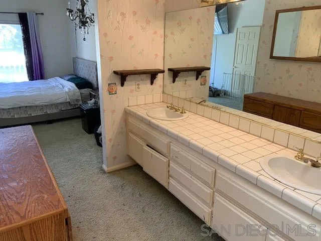 43982 Highlander Drive Temecula, CA 92592 - Photo 12 of 14 a bathroom with a sink and a mirror