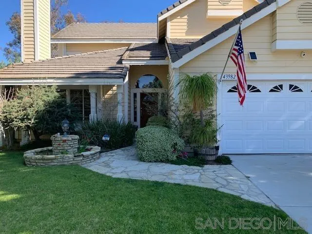 43982 Highlander Drive Temecula, CA 92592 - Photo 2 of 14 a front view of a house with garden