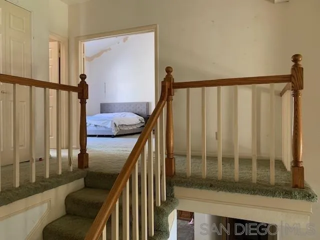 43982 Highlander Drive Temecula, CA 92592 - Photo 6 of 14 a view of stairs with wooden floor