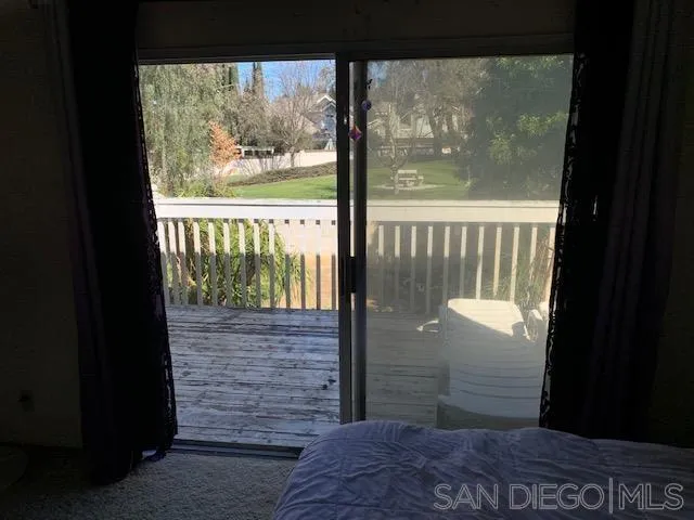 43982 Highlander Drive Temecula, CA 92592 - Photo 9 of 14 a view of a glass door with a balcony from a room