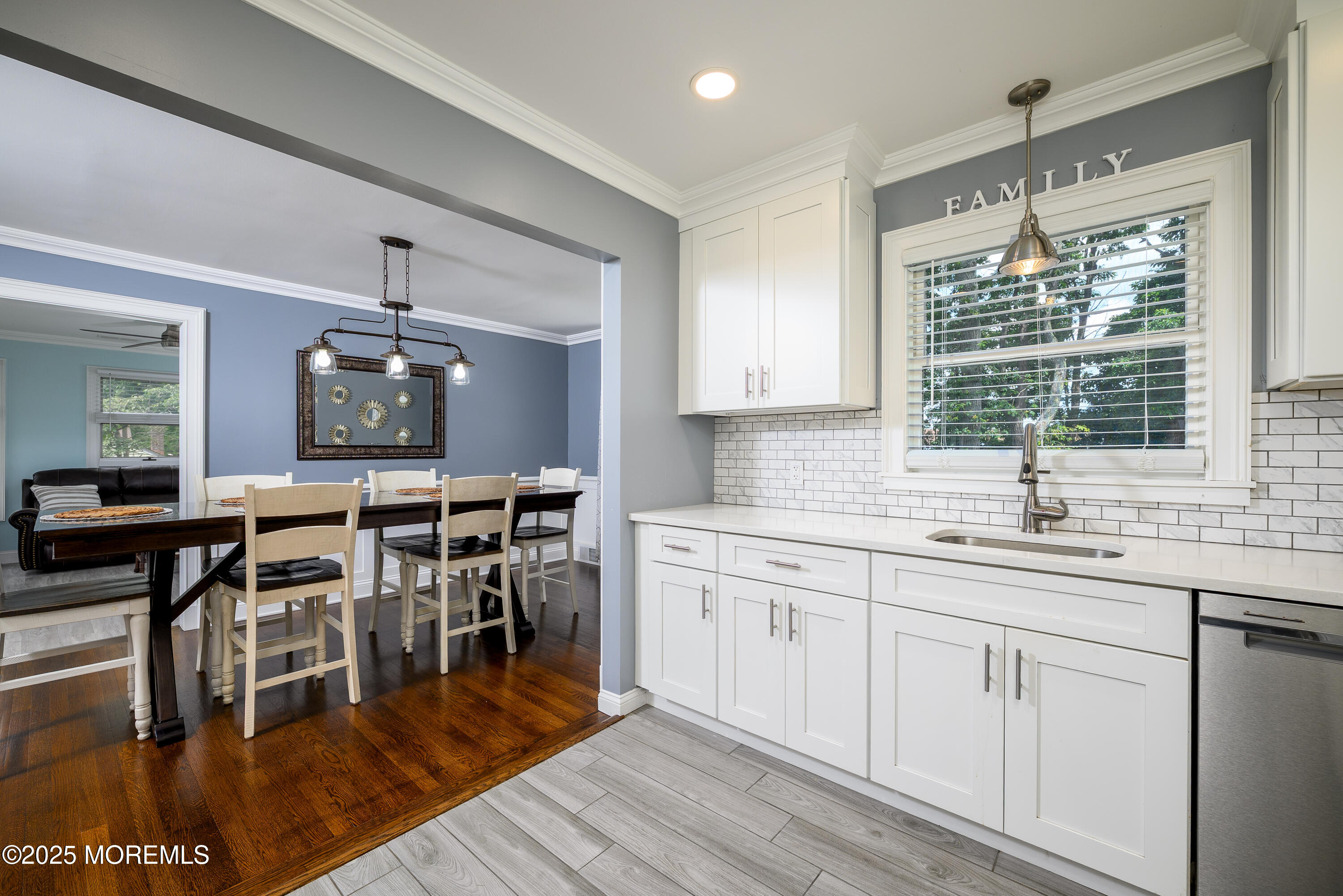 3213 Ridgewood Road Allenwood, NJ 08720 - Photo 12 of 42 a kitchen with sink cabinets and dining table