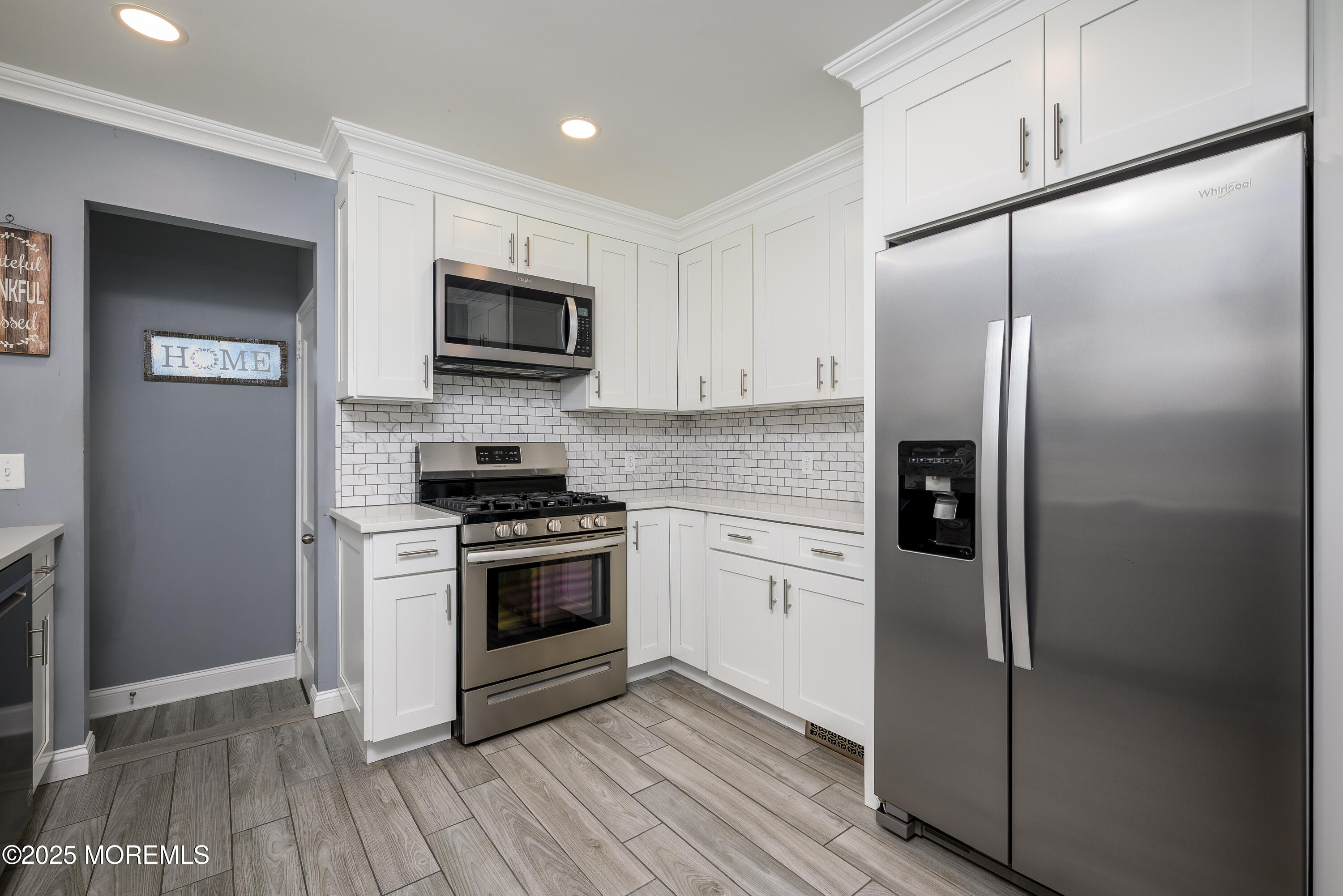 3213 Ridgewood Road Allenwood, NJ 08720 - Photo 14 of 42 a kitchen with stainless steel appliances granite countertop a refrigerator stove and microwave