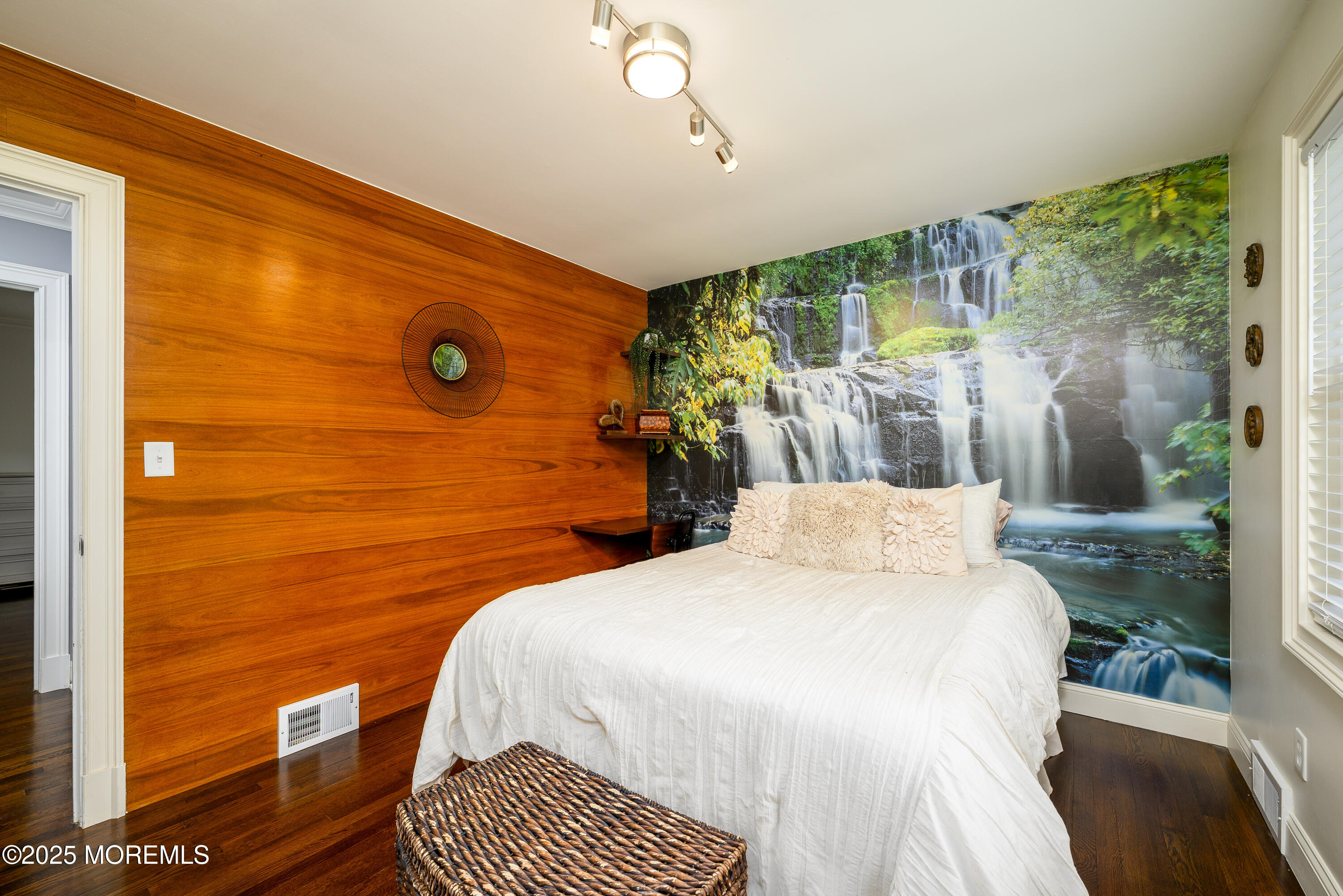 3213 Ridgewood Road Allenwood, NJ 08720 - Photo 22 of 42 a bedroom with a bed and wooden floor