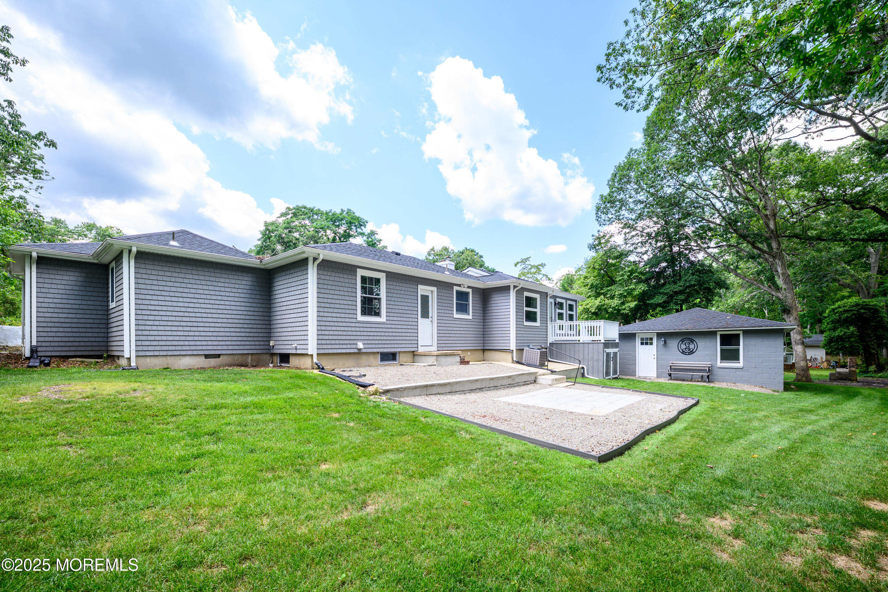3213 Ridgewood Road Allenwood, NJ 08720 - Photo 34 of 42 a view of a house with a backyard and a patio