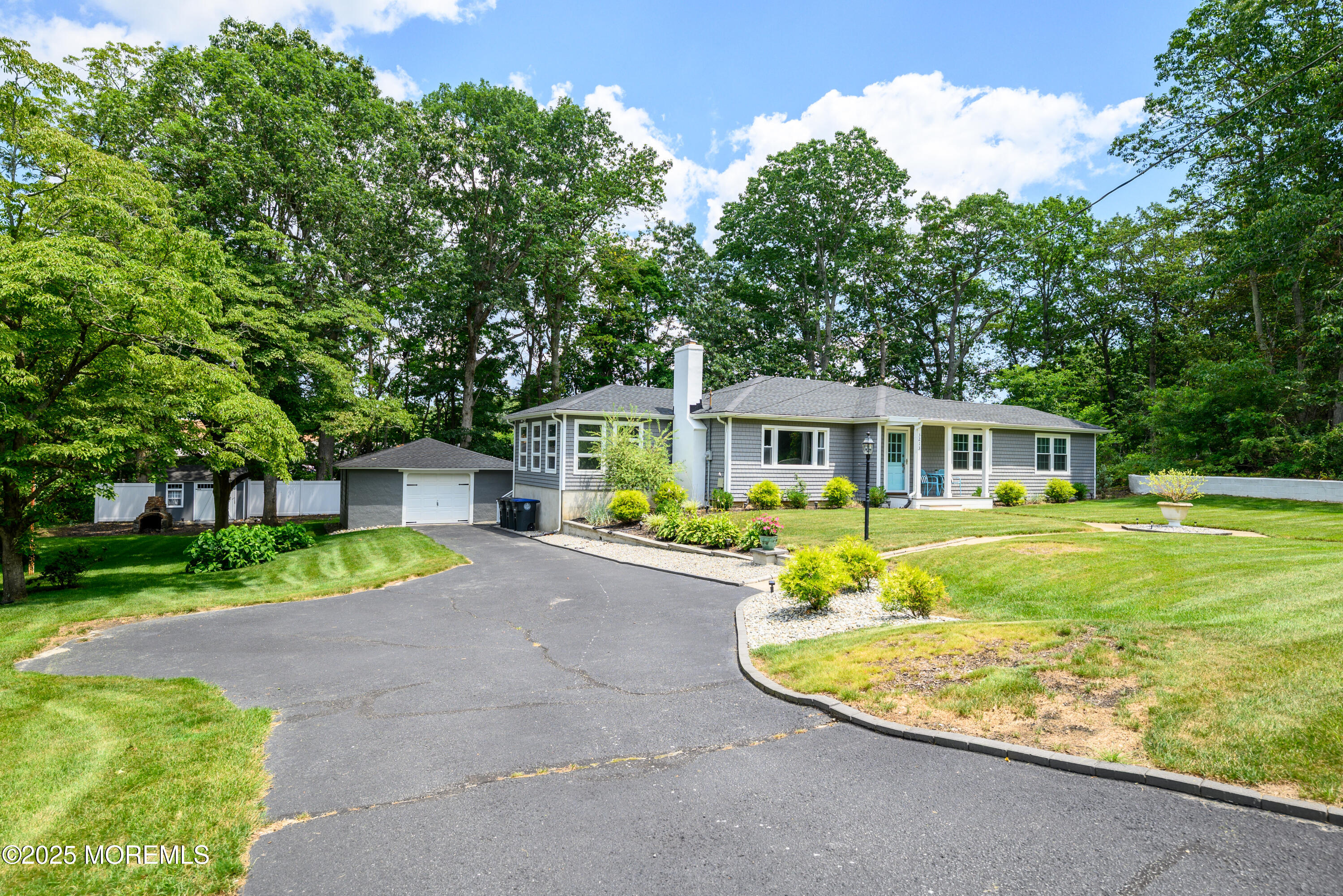3213 Ridgewood Road Allenwood, NJ 08720 - Photo 4 of 42 a front view of a house with garden