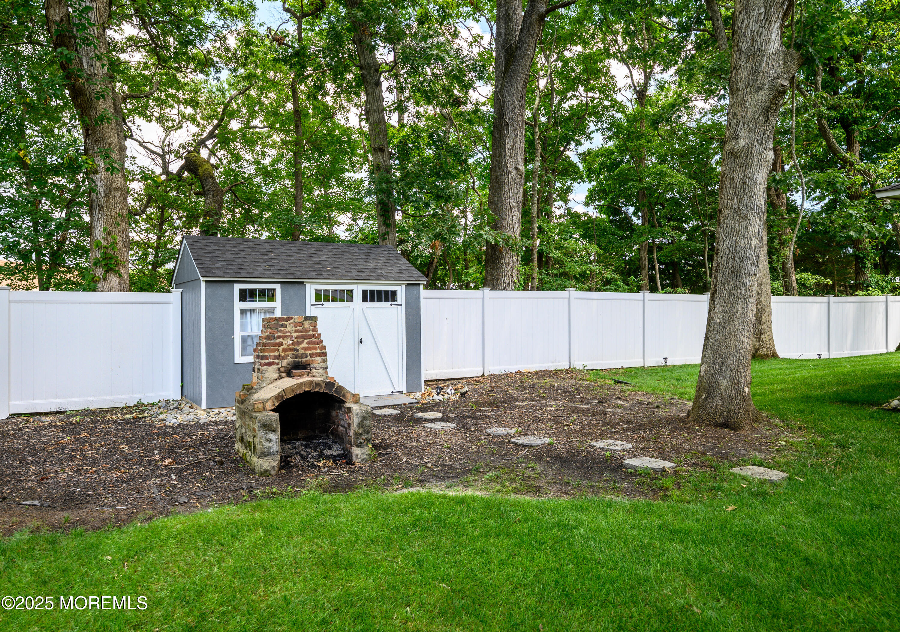 3213 Ridgewood Road Allenwood, NJ 08720 - Photo 7 of 42 a view of back yard of the house