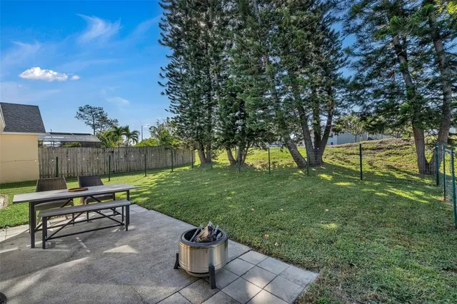 a view of a two chairs in a park