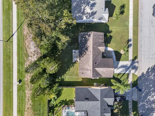 an aerial view of a house with outdoor space