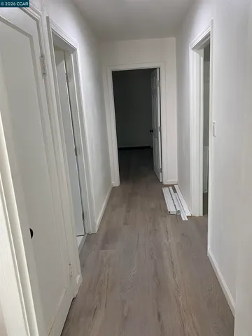 an empty room with wooden floor