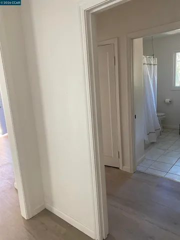 a kitchen with a sink a large window next to a yard