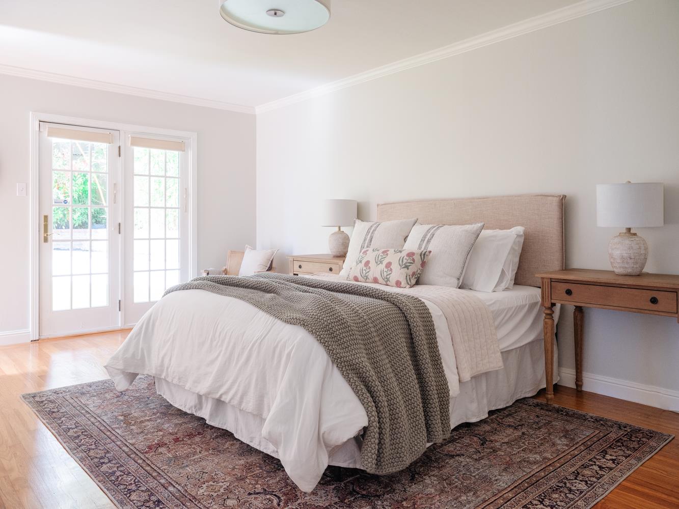 802 Covington Road Belmont, CA 94002 - Photo 12 of 28 a bedroom with a bed and wooden floor