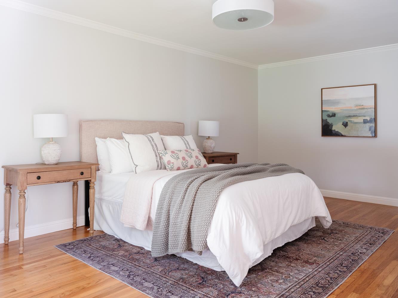 802 Covington Road Belmont, CA 94002 - Photo 13 of 28 a bedroom with a bed and a painting on the wall