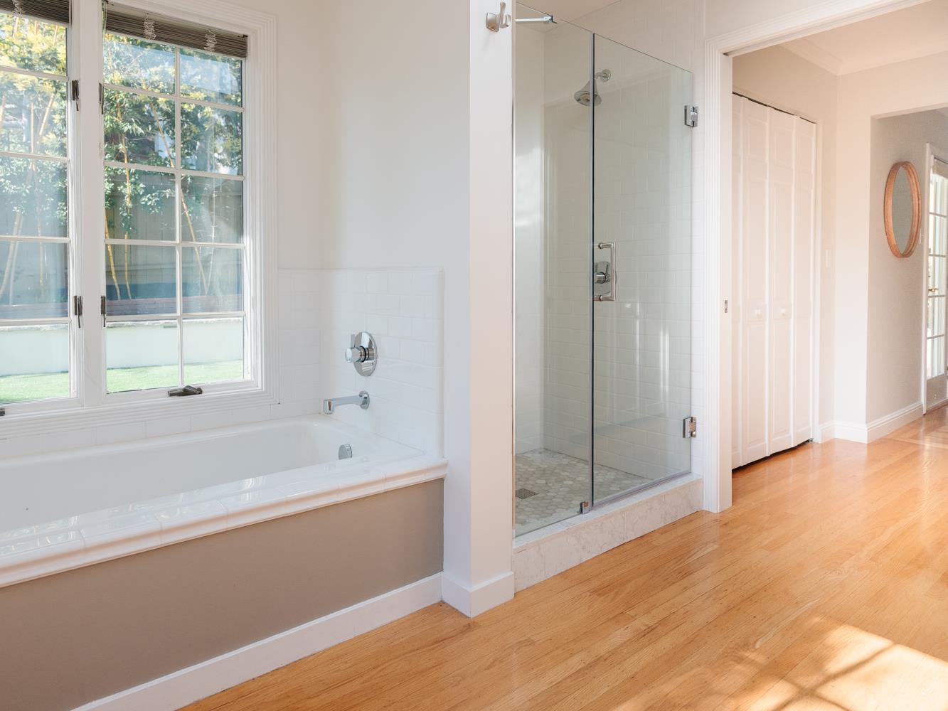 802 Covington Road Belmont, CA 94002 - Photo 14 of 28 a bathroom with a bathtub and a shower