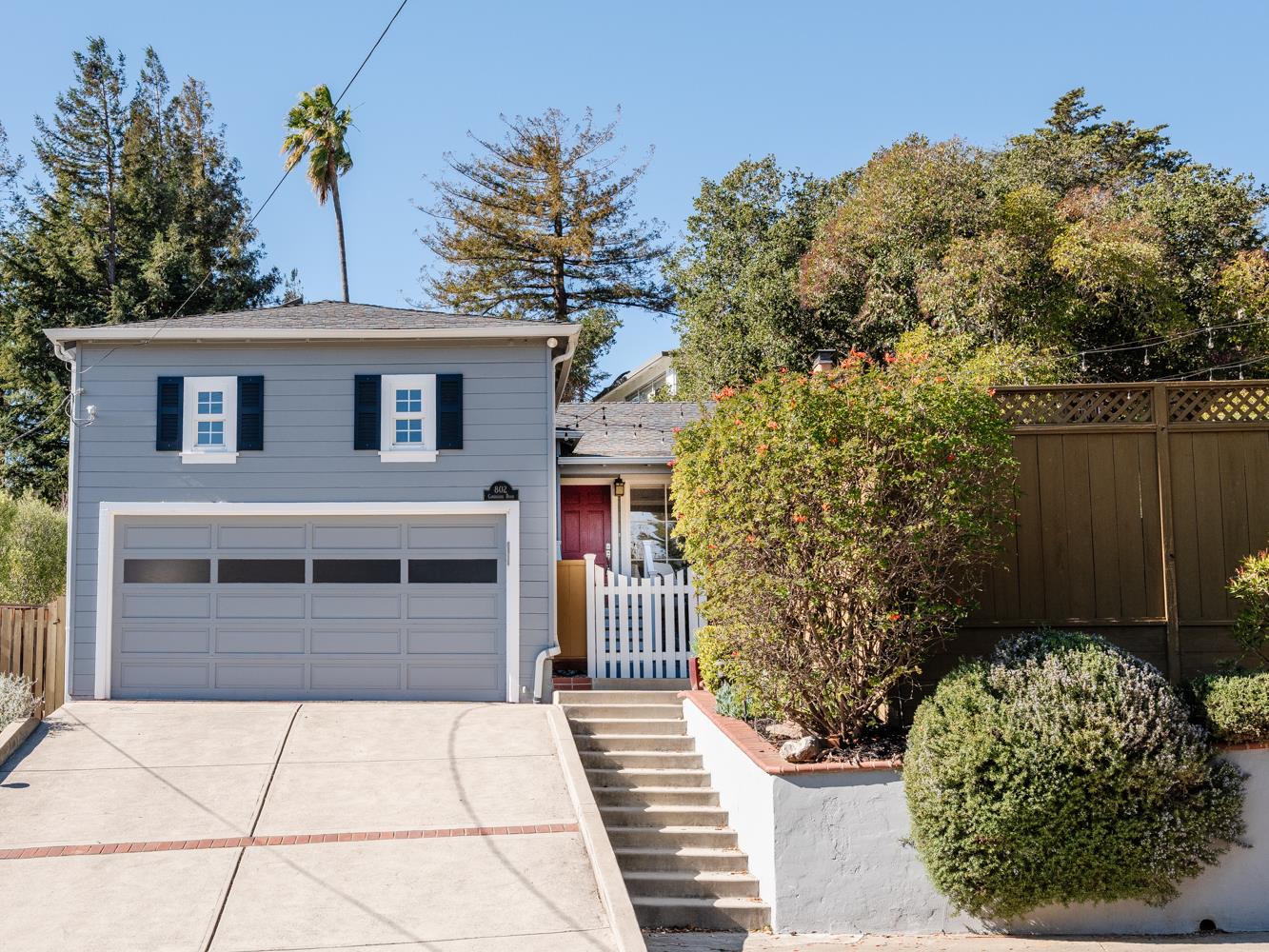 802 Covington Road Belmont, CA 94002 - Photo 2 of 28 a front view of a house with a garden
