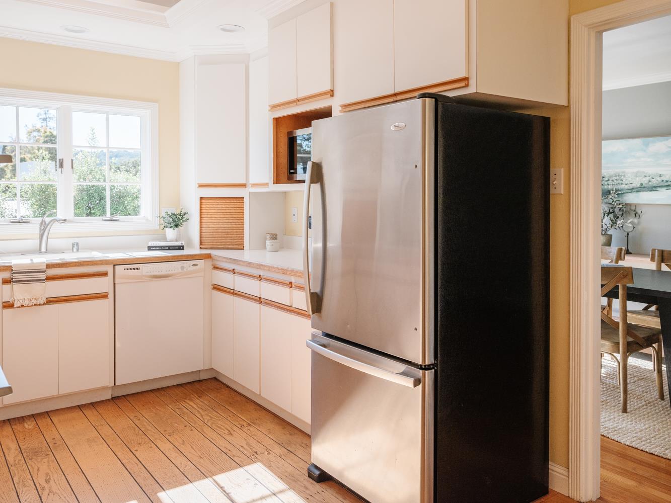 802 Covington Road Belmont, CA 94002 - Photo 10 of 28 a white refrigerator freezer sitting inside of a kitchen