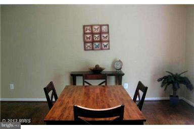 5518 Deale Churchton Road Churchton, MD 20733 - Photo 3 of 11 a view of a dining room with furniture and wooden floor