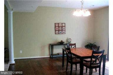 5518 Deale Churchton Road Churchton, MD 20733 - Photo 4 of 11 a view of a dining room with furniture and wooden floor