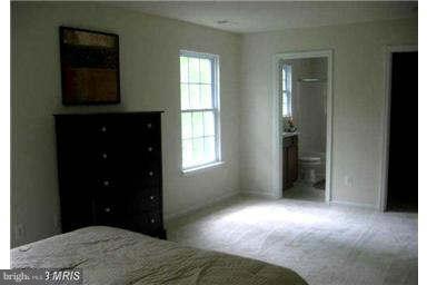 5518 Deale Churchton Road Churchton, MD 20733 - Photo 8 of 11 a bedroom with a bed and a window