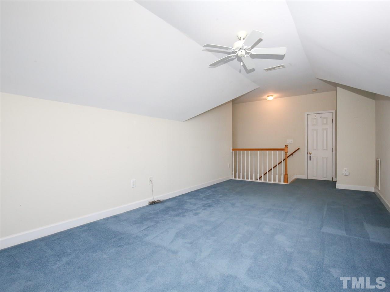 4912 Windmere Chase Drive Raleigh, NC 27616 - Photo 22 of 30 an empty room with a ceiling fan and a ceiling fan