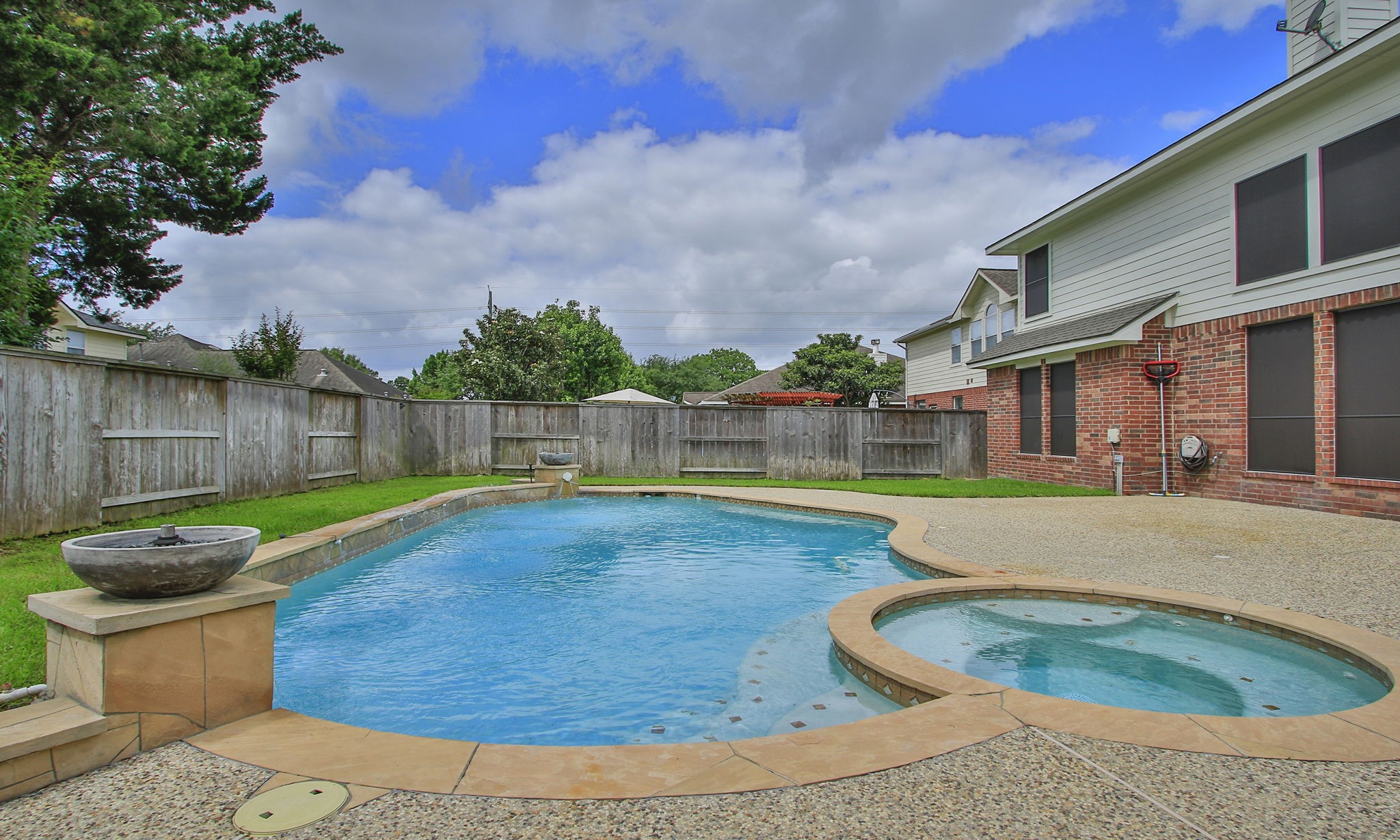 1210 Berwick Manor Court Spring, TX 77379 - Photo 44 of 50 a view of a backyard with swimming pool