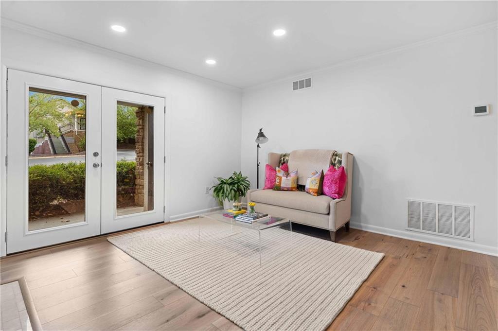 1150 Collier Road Northwest, Unit A1 Atlanta, GA 30318 - Photo 2 of 27 a living room with furniture and a window