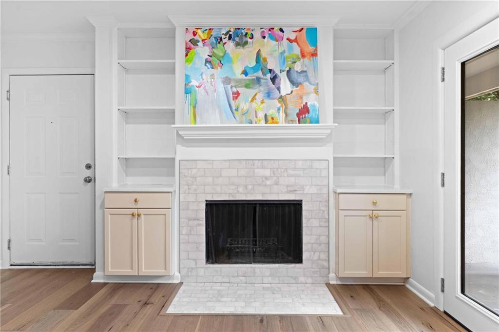 1150 Collier Road Northwest, Unit A1 Atlanta, GA 30318 - Photo 4 of 27 a view of a hallway with fireplace and wooden floor