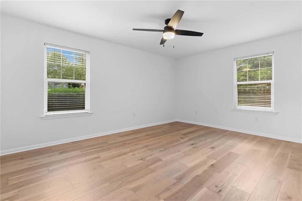 1150 Collier Road Northwest, Unit A1 Atlanta, GA 30318 - Photo 10 of 27 a view of empty room with wooden floor and fan