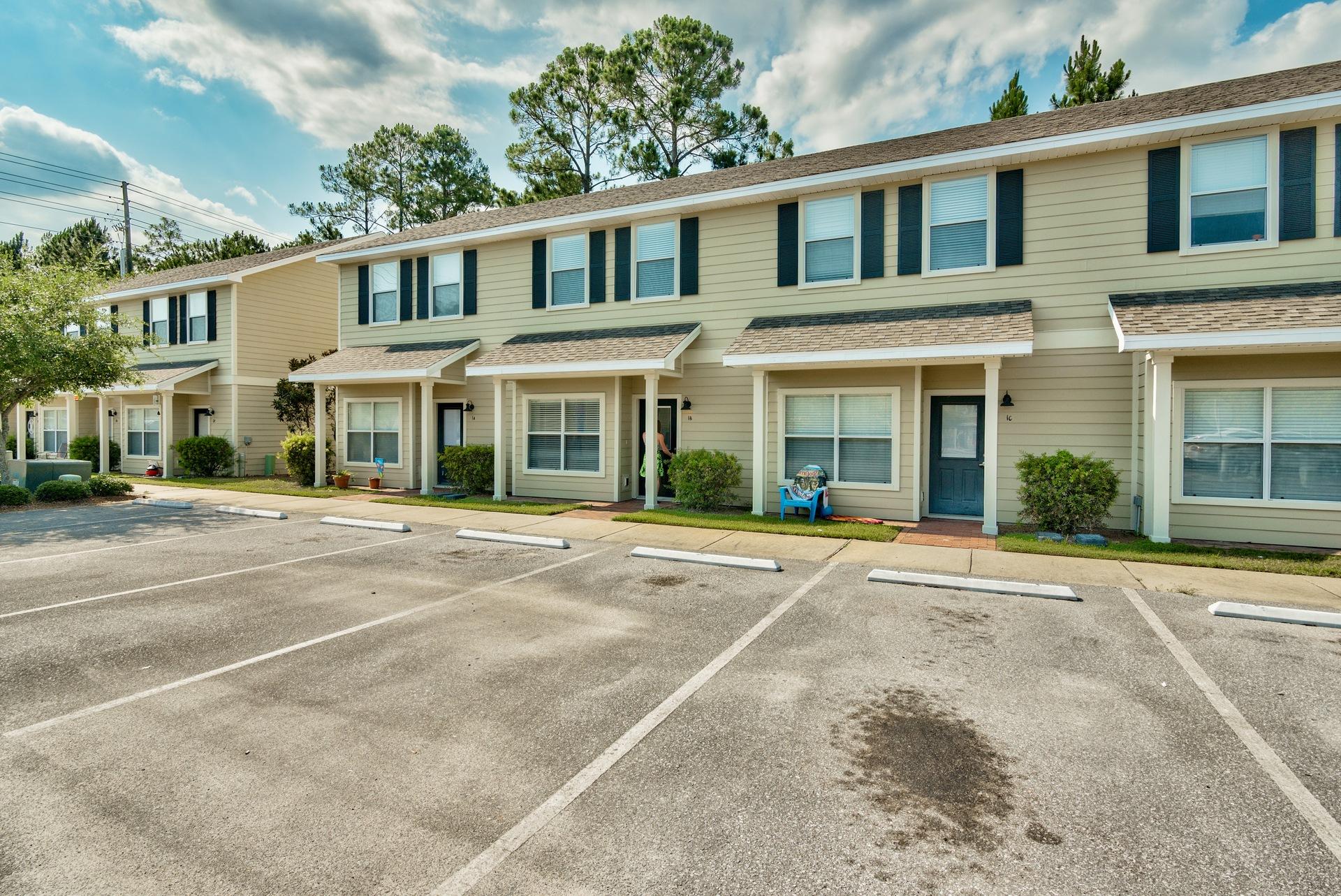 15284 331 Business, Unit 5A Freeport, FL 32439 - Photo 26 of 31 front view of a brick house with a yard