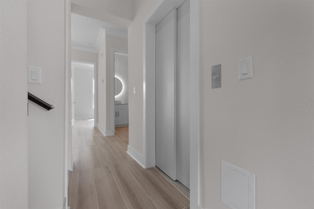 772 Gran Kaymen Way Apollo Beach, FL 33572 - Photo 27 of 35 a view of a room with wooden floor