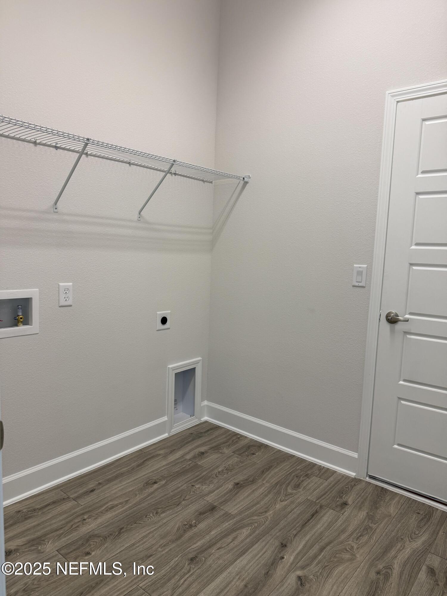 8278 Helmsley Boulevard Jacksonville, FL 32219 - Photo 11 of 27 a view of a room with wooden floor