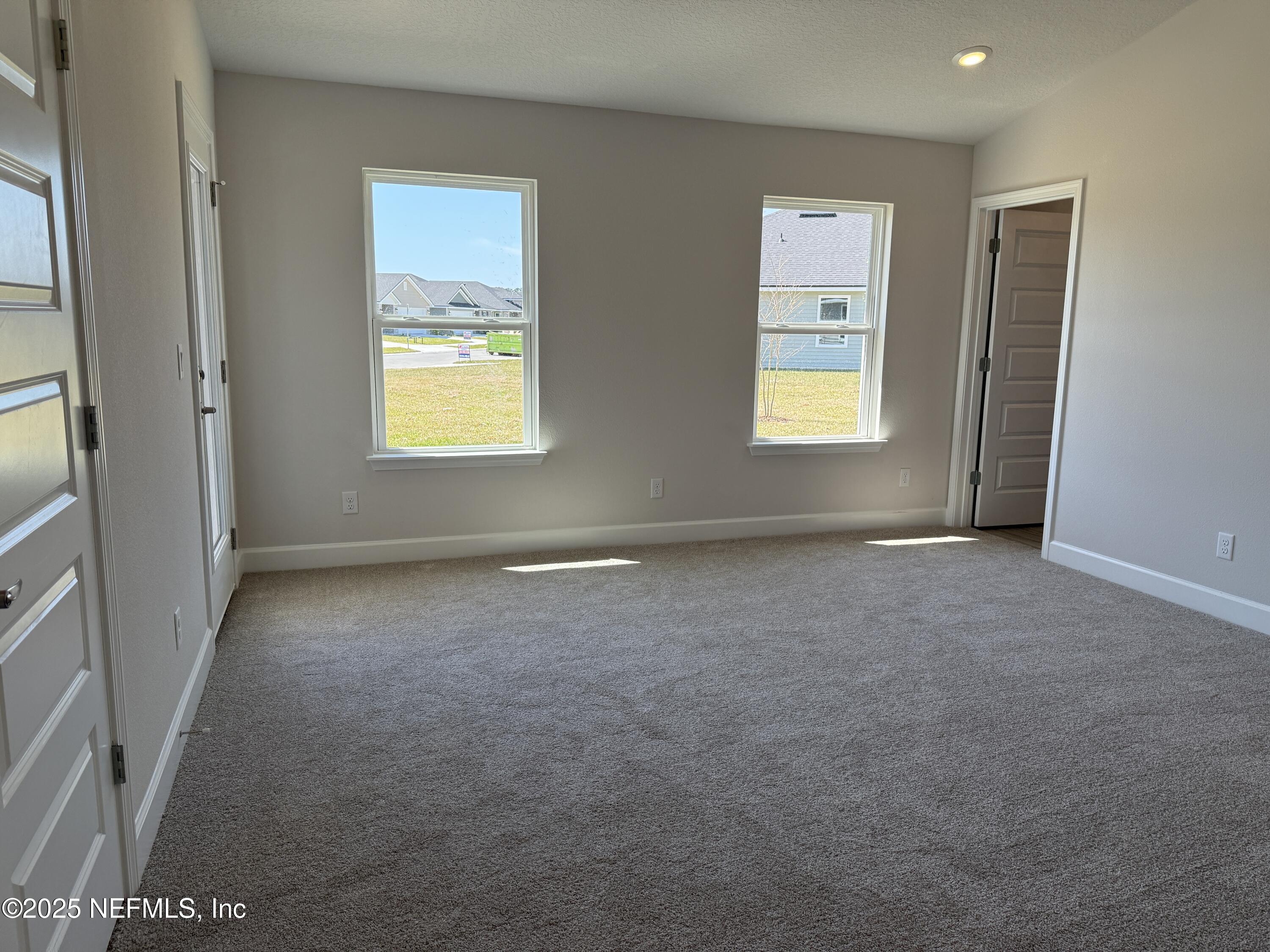 8278 Helmsley Boulevard Jacksonville, FL 32219 - Photo 14 of 27 an empty room with windows