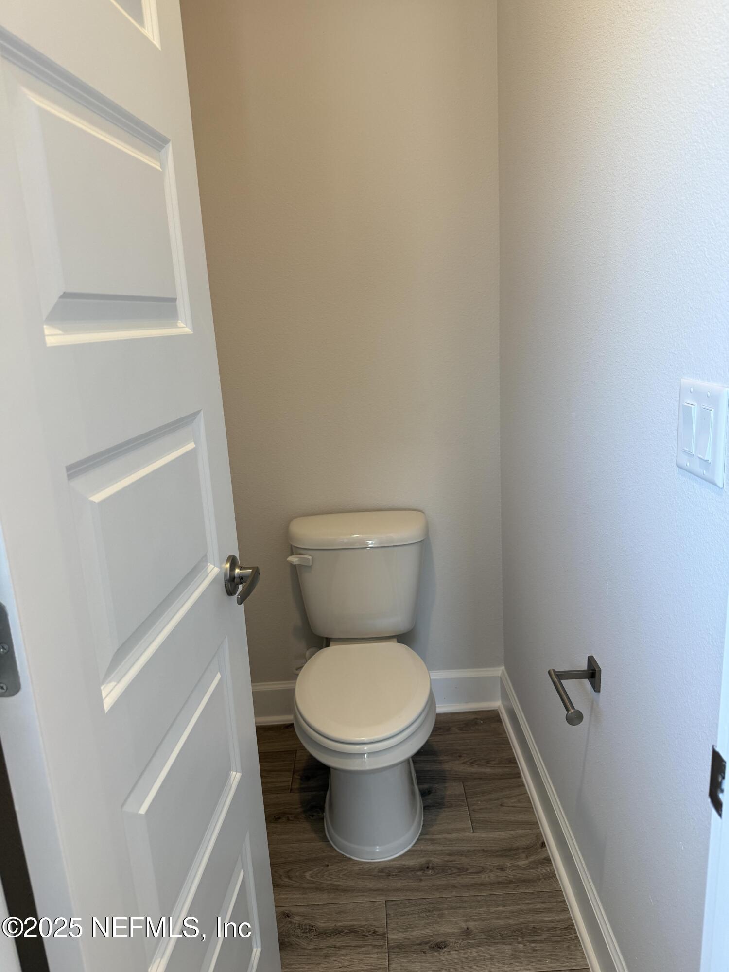 8278 Helmsley Boulevard Jacksonville, FL 32219 - Photo 16 of 27 a white toilet sitting in a bathroom